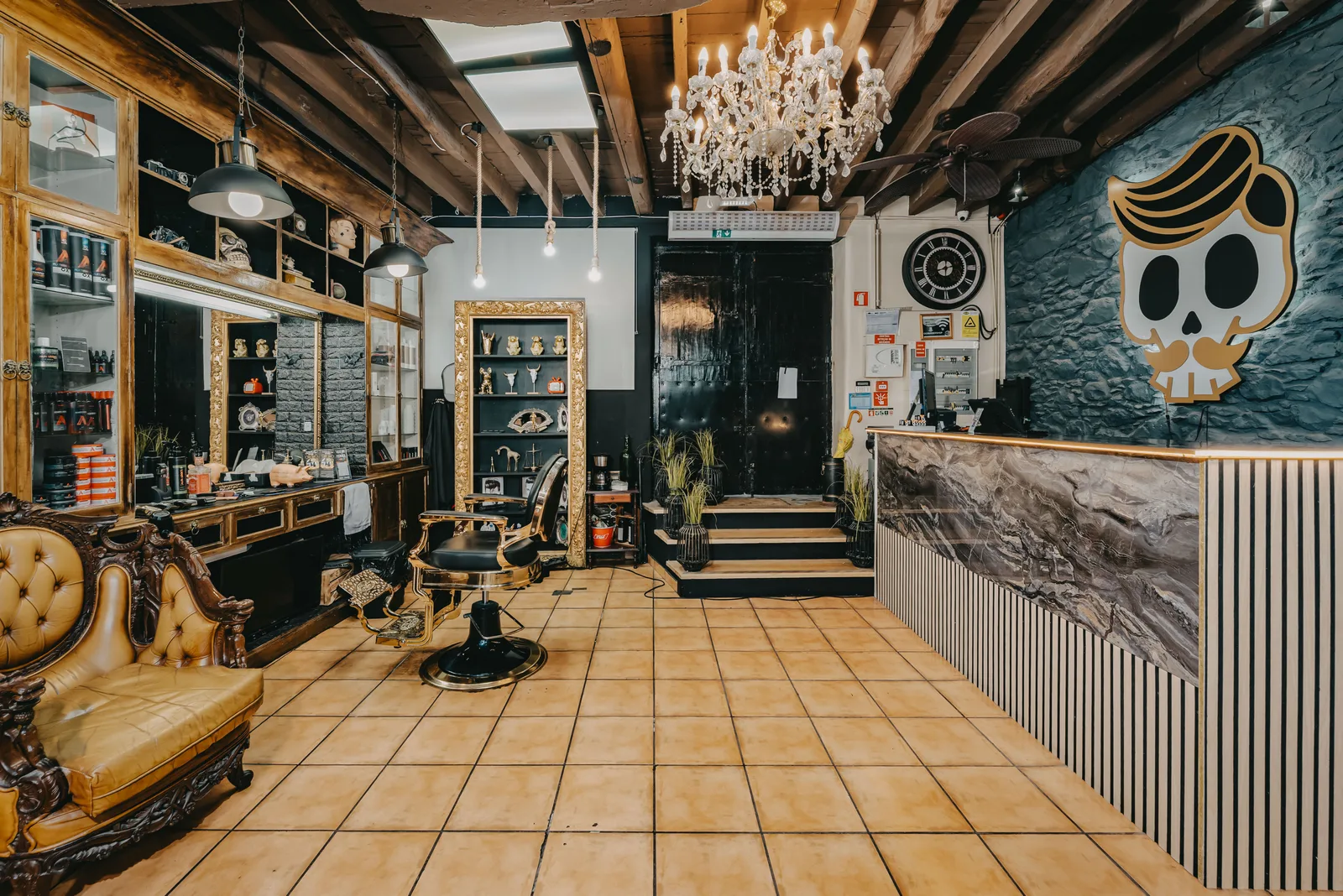 Reception at Old Skull Rua dos Aranhas, with marble counter and brand emblem