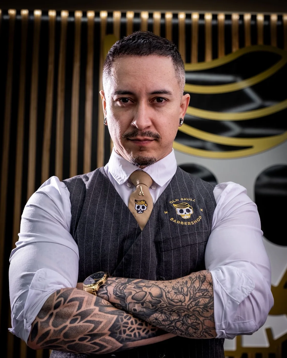 Weslley Guimarães, founder of Old Skull, inside one of the barbershops