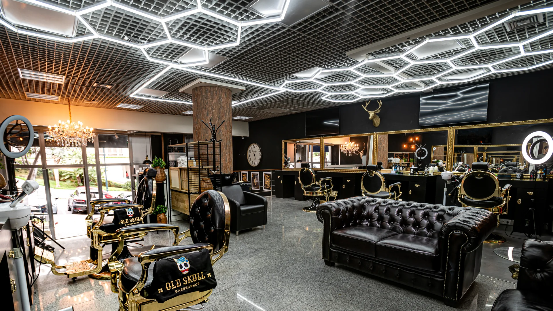 Old Skull Barbershop near Forum Madeira, with classic chairs and gold mirrors